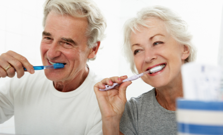 Older people brushing teeth